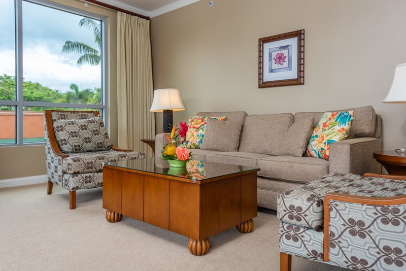 Chic tropical living room with natural light and cozy seating