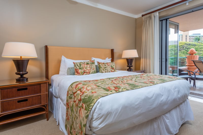 Tranquil bedroom retreat with tropical decor and private lanai access