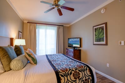 Tropical elegance meets comfort in a bright coastal bedroom retreat.