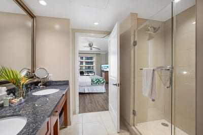 Spacious bathroom retreat with double vanity and sleek glass shower.