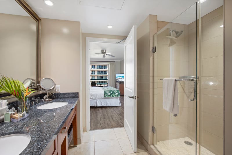 Spacious bathroom retreat with double vanity and sleek glass shower.