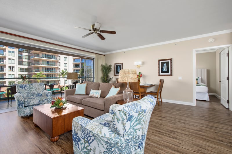 Bright coastal living room with tropical charm and garden-view lanai access.