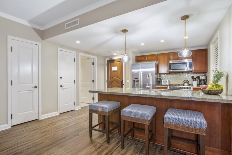 Sleek island kitchen with modern appliances and inviting breakfast seating.