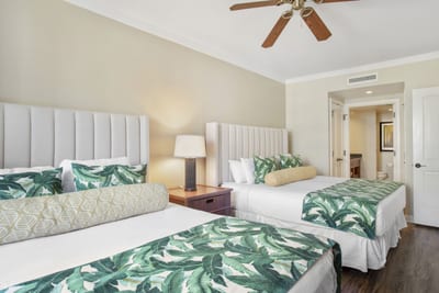 Bright double-bed suite with tropical accents and ensuite bathroom comfort.