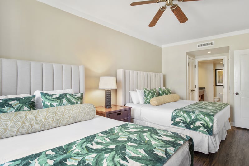 Bright double-bed suite with tropical accents and ensuite bathroom comfort.