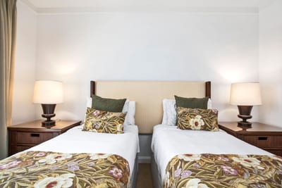 Cozy twin beds invite laughter and making memories