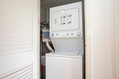 In-unit stacked washer and dryer for convenient guest laundry access