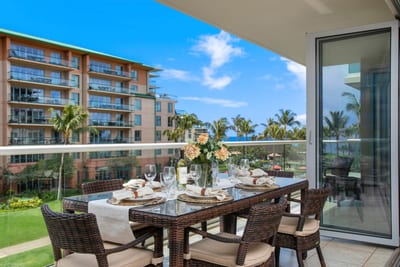 Elegant balcony dining with ocean breeze, tropical views, and sunshine.