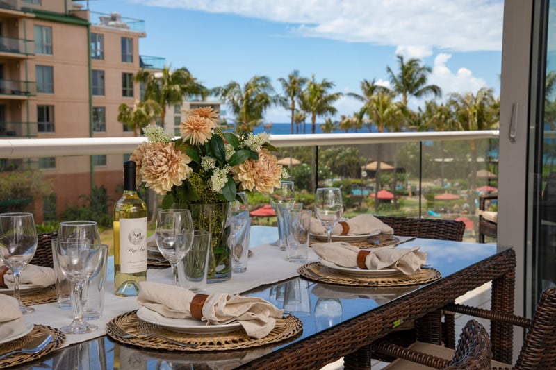 Island dining delight with ocean breeze, tropical flowers, and fine wine.
