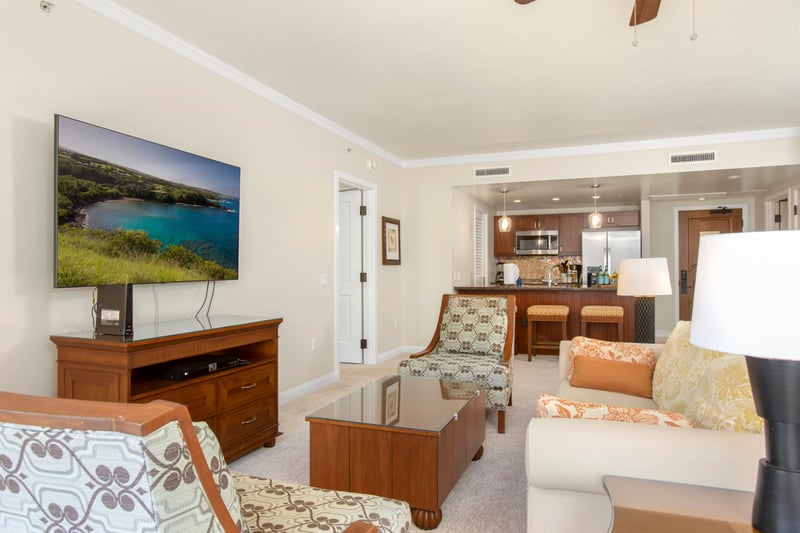 Spacious island suite with modern kitchen, cozy seating, and entertainment. HKK-343