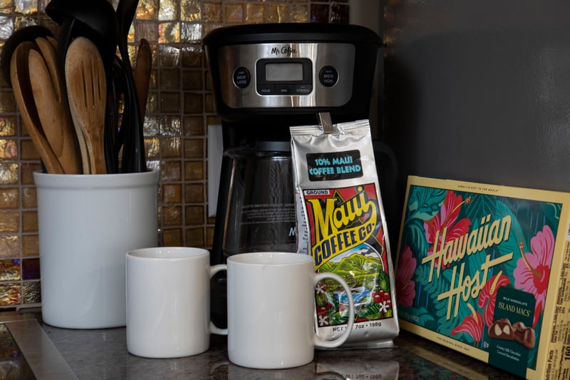 Island morning essentials: Maui coffee, mugs, Hawaiian chocolates, and tropical charm.