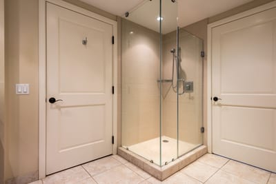 Floor to ceiling glass enclosed shower fine tile details HKK-424