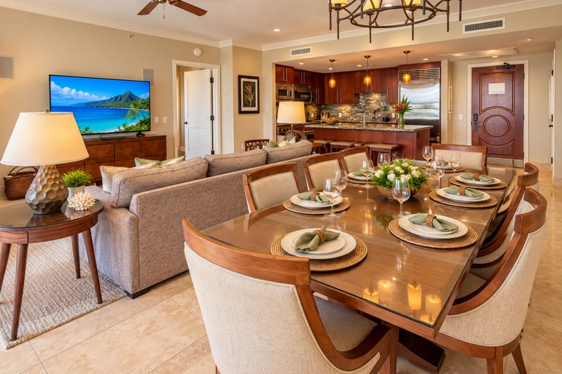 A large flat screen television faces the sofa, while the dining table beside it gives the group room to share meals together.