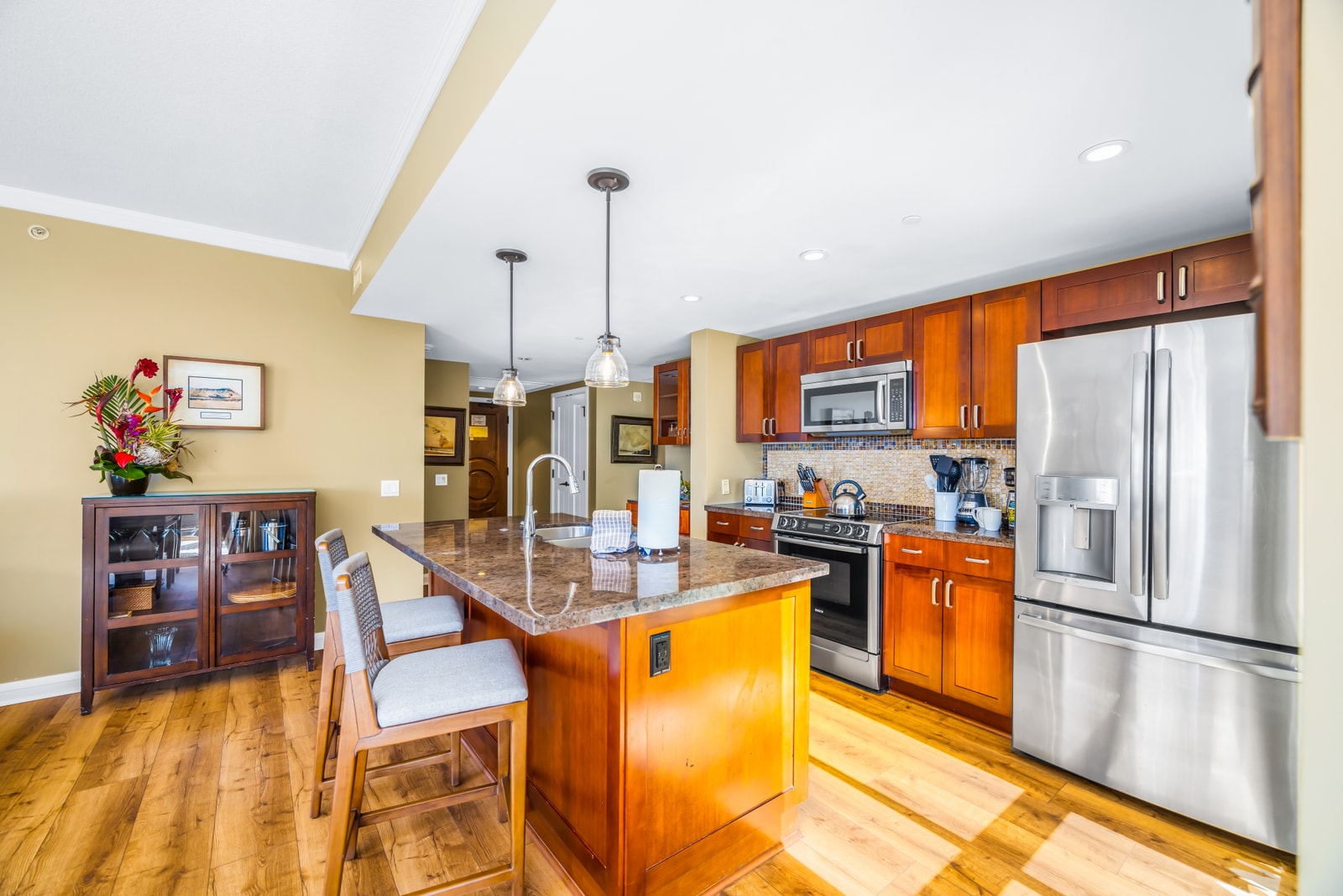 Your fully equipped kitchen features granite counters, stainless steel appliances, and everything you need for home-cooked meals. HKK-439