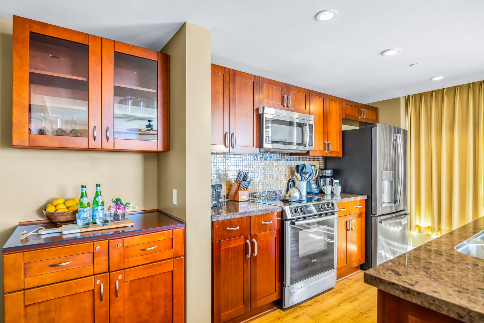 High-end appliances, granite counters, and ample cabinetry make cooking a breeze in your private villa. HKK-439