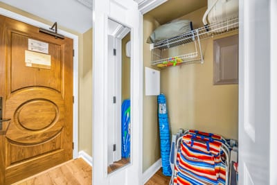 Grab beach gear or extra towels from the entry closet, perfectly located for a day in the sun.