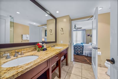 Conveniently located, this full guest bath features a granite vanity and walk-in shower with glass doors.