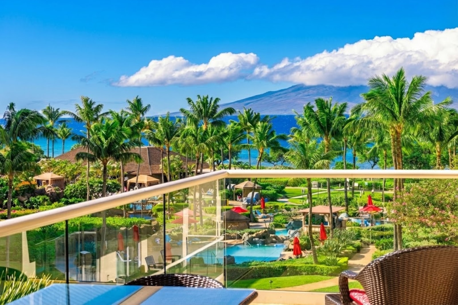 The views from your fourth-floor villa stretch from the resort palms all the way to the island’s volcanic peaks. HKK-439