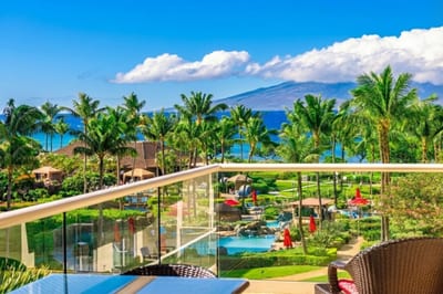 The views from your fourth-floor villa stretch from the resort palms all the way to the island’s volcanic peaks.