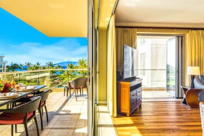The shaded balcony offers the perfect retreat for meals or cocktails, with space to spread out and enjoy the breeze.