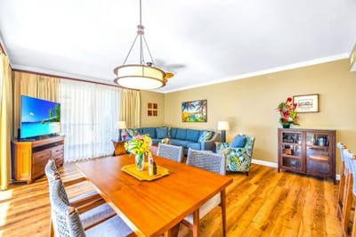 The dining area opens to both the kitchen and balcony, so meals come with conversation and a view.