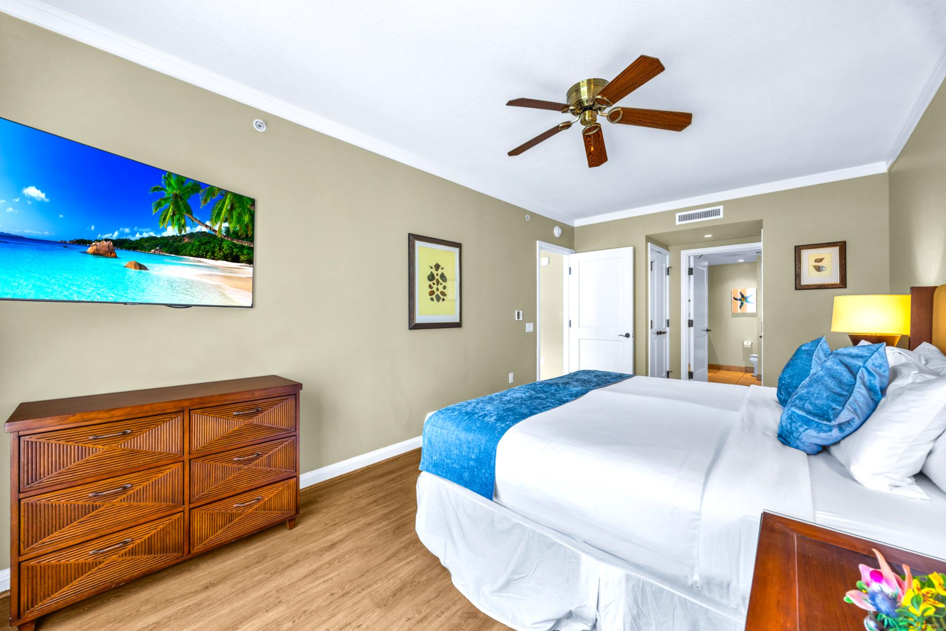 The comfortable guest bedroom features a king size bed, perfect for family or friends HKK-443