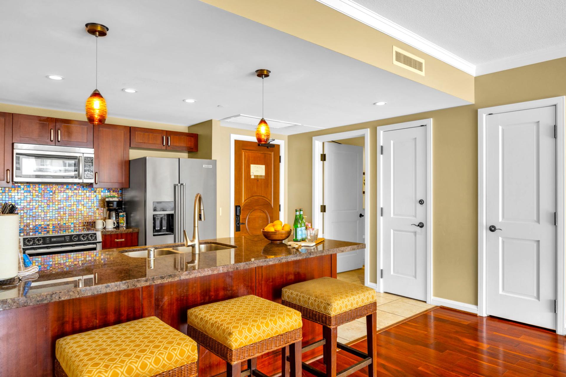 Open kitchen and breakfast bar for quick bites and laughs