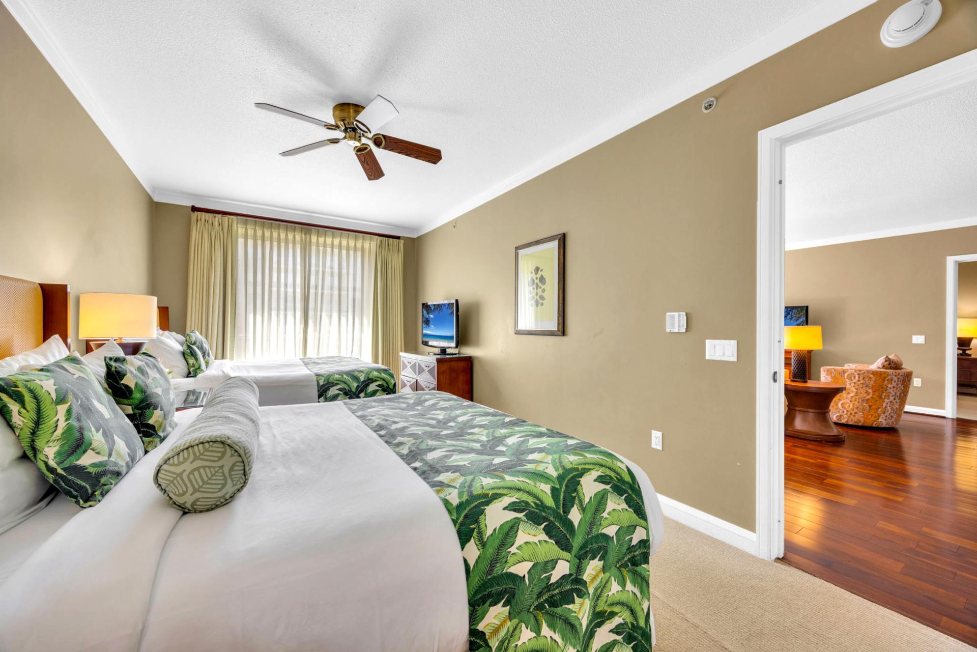 Spacious guest room with soft tropical accents