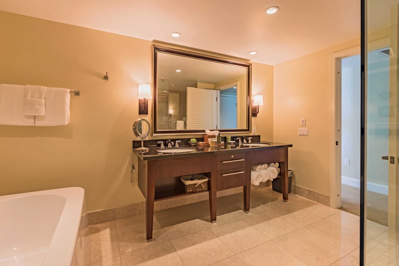 Elegant double vanities and a soaking tub invite you to take your time