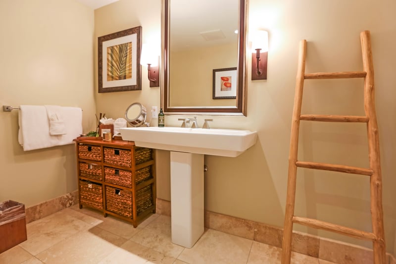 Thoughtfully designed with warm details this guest bath is anything but basic