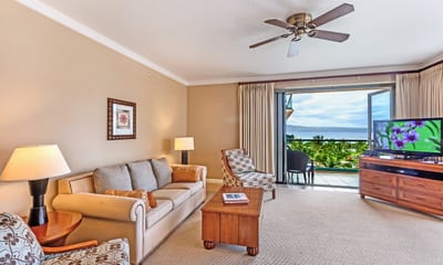 Spacious oceanview suite with tropical charm and modern comfort inside.