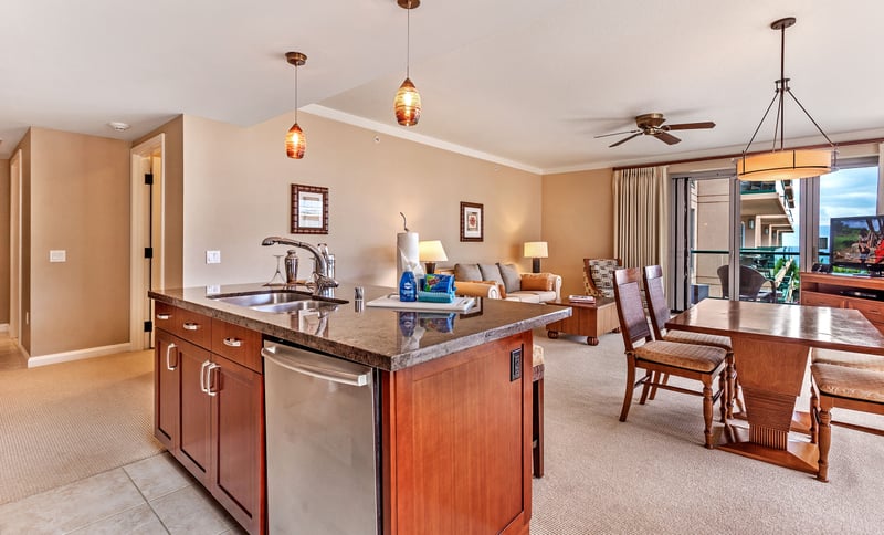 Bright open living space with island kitchen and balcony view. HKK-513