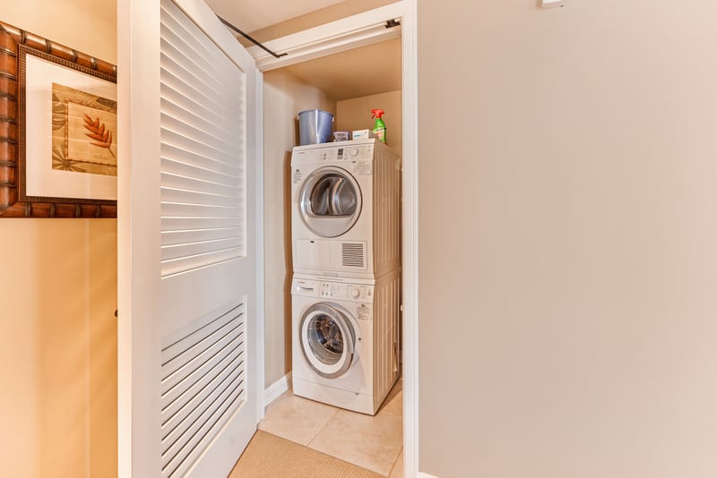 Convenient in-room laundry with stacked washer and dryer unit. HKK-513