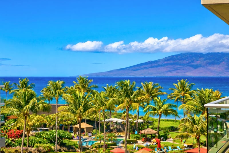 Palm trees and the blue Pacific stretch beyond Honua Kai’s lush grounds, giving your stay sweeping island views and the feeling of a true beachfront escape. HKK-537