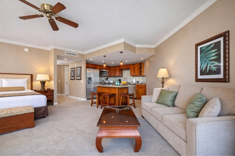 Your open studio welcomes you with a plush bed, sofa seating, and a full kitchen just steps away, creating an easy space for both rest and island living. HKK-537