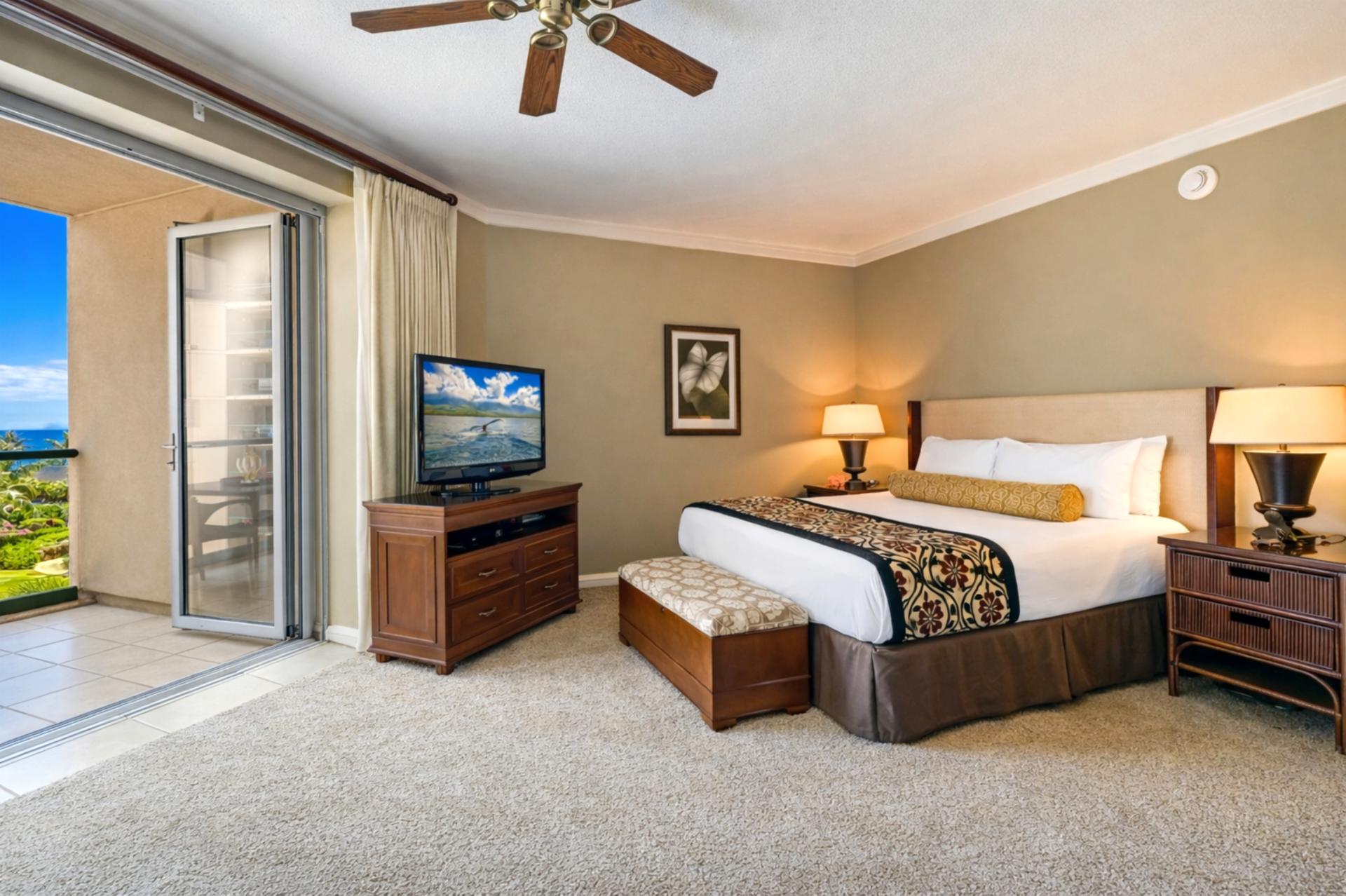 From your bed you can look toward your private lanai and TV area, keeping the space bright, open, and easy to enjoy throughout your stay.
