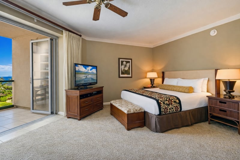 From your bed you can look toward your private lanai and TV area, keeping the space bright, open, and easy to enjoy throughout your stay. HKK-537