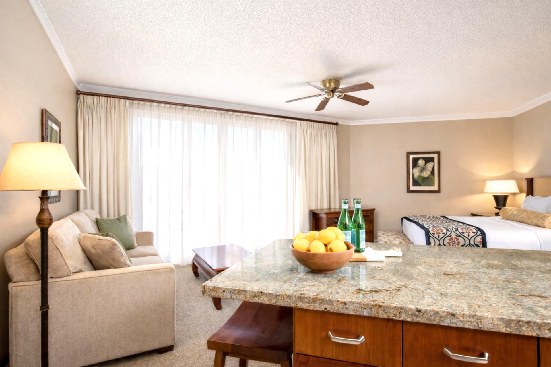 Granite bar seating offers a comfortable spot for breakfast, cocktails, or conversation after a day exploring Kaanapali. 