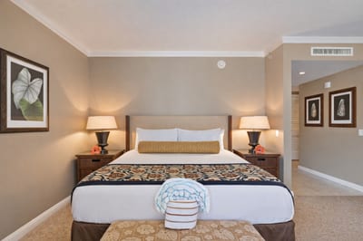 Your sleeping area features crisp bedding, warm island decor, and soft lighting that makes settling in after a beach day feel effortless. HKK-537