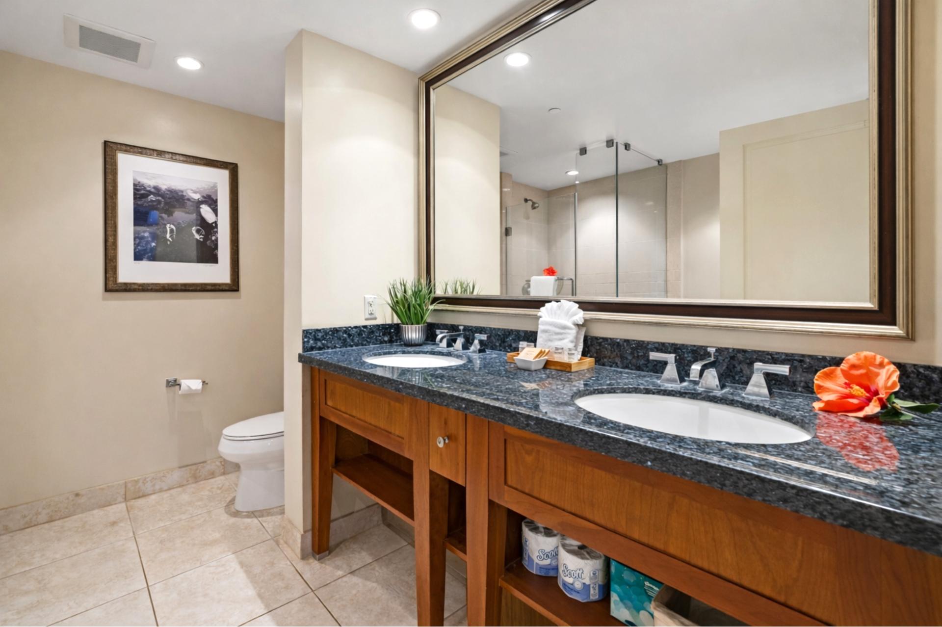 Granite counters and a spacious vanity give you plenty of room to get ready for the day, with clean contemporary finishes throughout your bathroom.