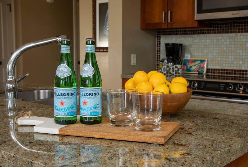 Refreshing island welcome with sparkling water, citrus fruit, and sunshine hospitality.