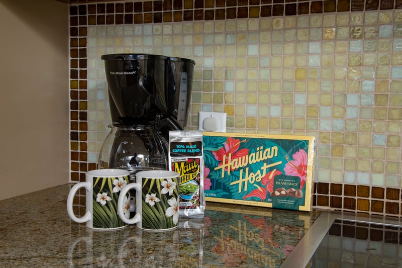 Island mornings start with Maui coffee, Hawaiian treats, and floral mugs.