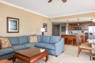 Spacious island retreat with cozy seating, gourmet kitchen, and elegance.
