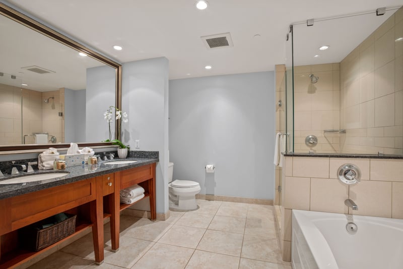 Spacious bathroom with double vanity and upgraded shower