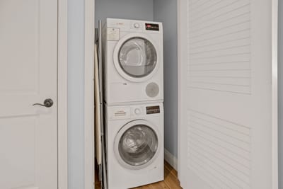 Convenient in-unit laundry with stacked Bosch washer and dryer appliances.