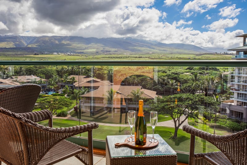 Relaxing balcony seating with stunning mountain resort views.