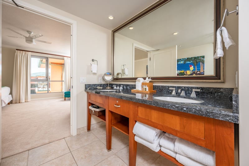 Spacious bathroom sanctuary with dual sinks and island-inspired elegance.