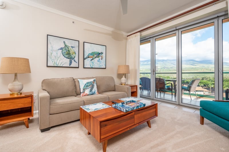 Island-inspired living room with serene views and cozy tropical charm.