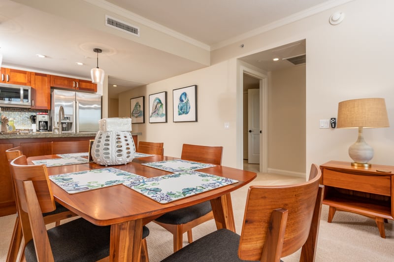 Gather around coastal elegance in this warm, inviting dining space.