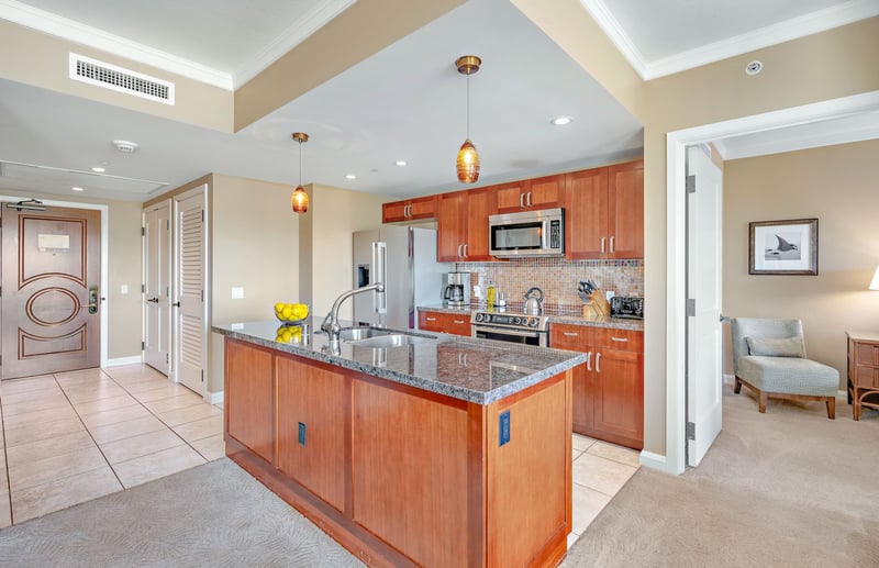 Open-concept kitchen with island flair, modern finishes, and tropical comfort. HKK-820